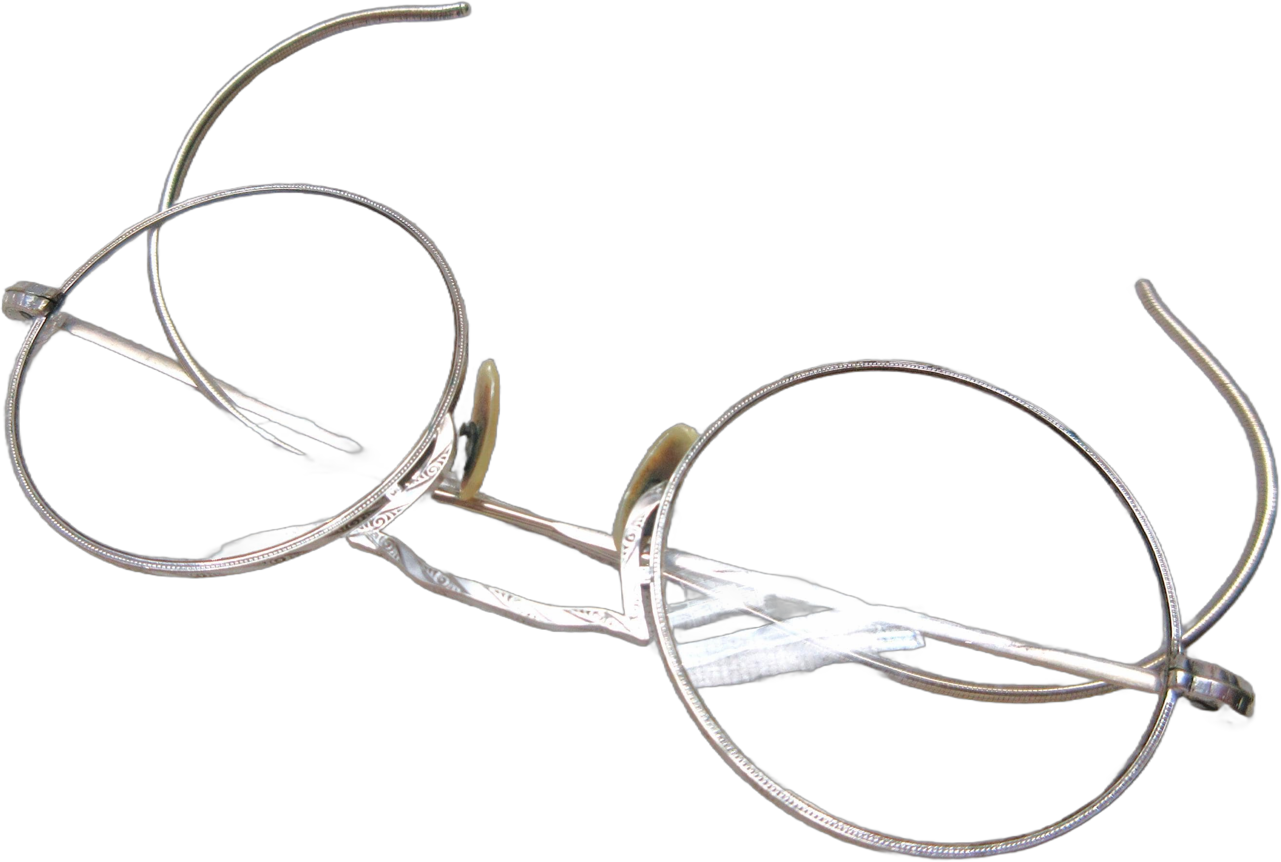 Vintage round wire frame eyeglasses with decorative etching are marked 1/10, 12k. Lens are clear. 4.25&quot; across. Light prescription.